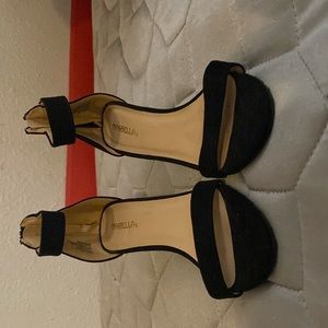 Im selling black heels, size 7, and the brand is Marbella